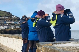 Living Seas Wales volunteers conducting a land survey in New Quay, South Wales