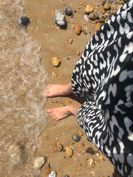 a photo of Daisy's feet paddling in the sea