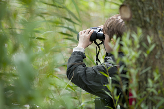 boy with binoculars Wildlife Trust