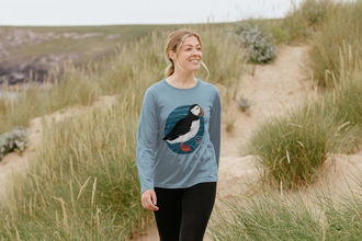 Woman wearing a puffin sweatshirt