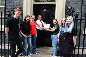 Wildlife Trusts youth ambassadors hand in the Environment Act Targets petition, signed by over 60,000 supporters