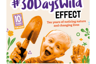30 Days Wild poster, featuring smiling child holding a trowel.