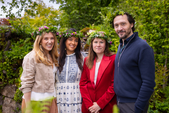 Liz Bonnin, Maddie Moate and David Oakes with garden designer Zoe Claymore at The British Rainforest Garden at RHS Chelsea. They are all wearing flower crowns