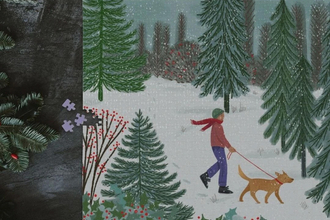 A jigsaw featuring an illustrated scene of a person walking their dog through a snowy conifer woodland