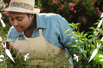 Woman in garden with stylised silhouettes of vegetables