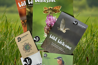 Contents of the Herefordshire Wildlife Trust membership pack, including welcome booklet, magazines and sticker