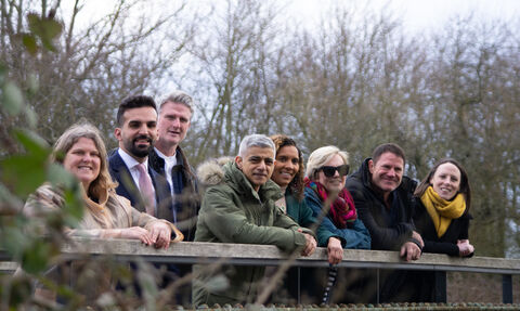 London Mayor Sadiq Khan and TV presenter Steve Backshall stood with London Wildlife Trust staff on a wooden bridge