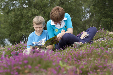 Kids reading Wildlife Watch magazine (c) Tom Marshall