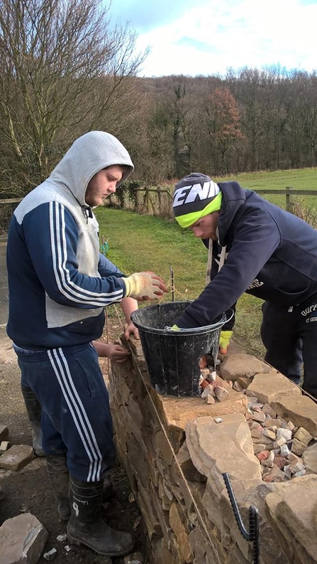 Liam brick-laying on a reserve