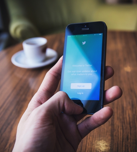 Phone in hand on twitter