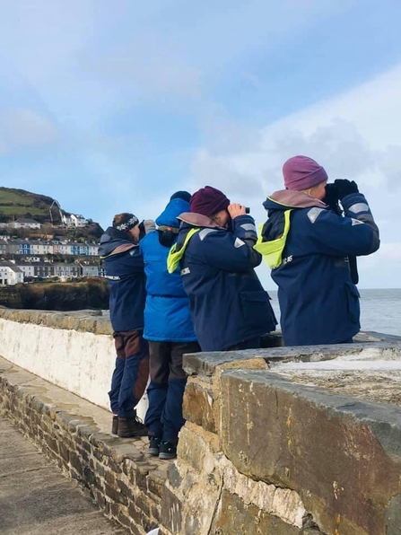 Living Seas Wales volunteers conducting a land survey in New Quay, South Wales
