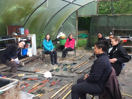 A group of Natural Prospects trainees learning about conservation tools