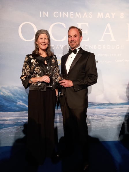 Ruth Williams, The Wildlife Trusts' head of marine conservation stood in front of the Ocean film poster with Matt Walpole, Chief Executive of Cornwall Wildlife Trust