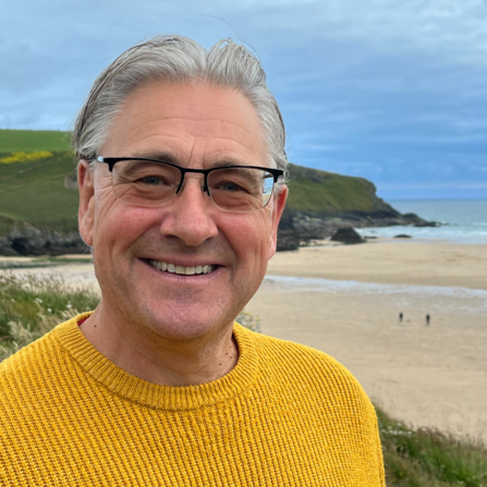 Callum Roberts smiling on the beach