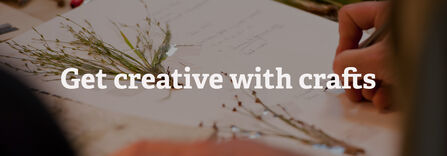 A person annotating next to grasses stuck into a notepad. Text reads Get creative with crafts
