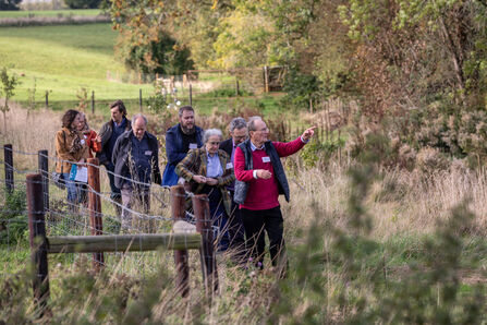 A group of people walking in the countryside