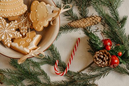 Edible Christmas decorations on a table with pine sprigs