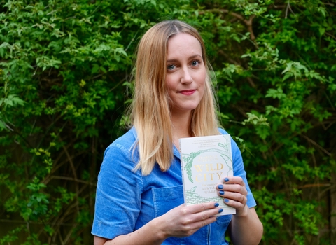 Florence Wilkinson holding her book.