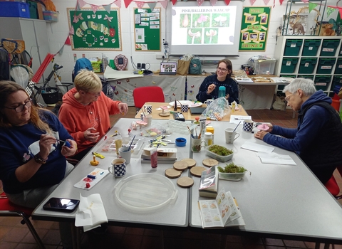 People inside doing crafts