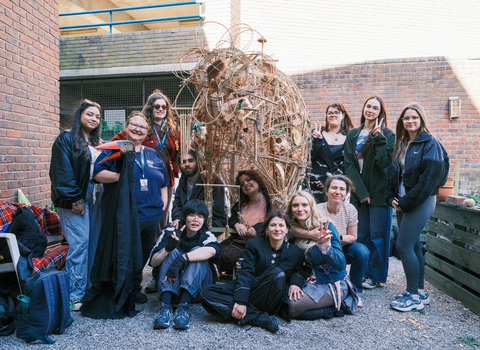 Young people and willow sculpture