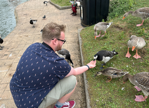 Sam feeding geese