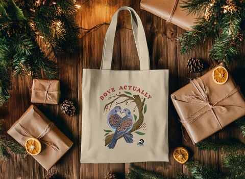 A tote bag with two doves illustrated on the front with the words Dove Actually